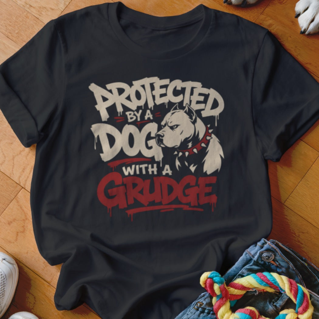 Black t-shirt with graphic "Protected by a Dog with a Grudge" and pitbull illustration.