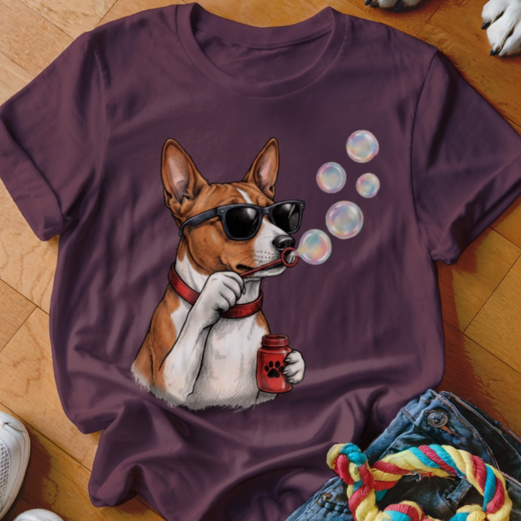 A dark purple crewneck t-shirt featuring a graphic of a brown and white dog wearing sunglasses and blowing bubbles.