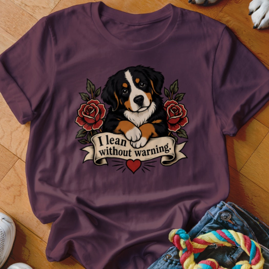 Bernese Mountain Dog puppy with roses and banner that reads "I lean without warning."