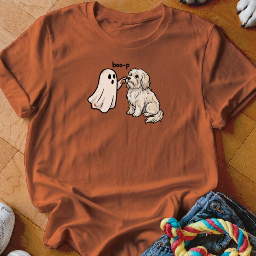 Orange t-shirt with cartoon ghost booping a white dog, text "boo-p".