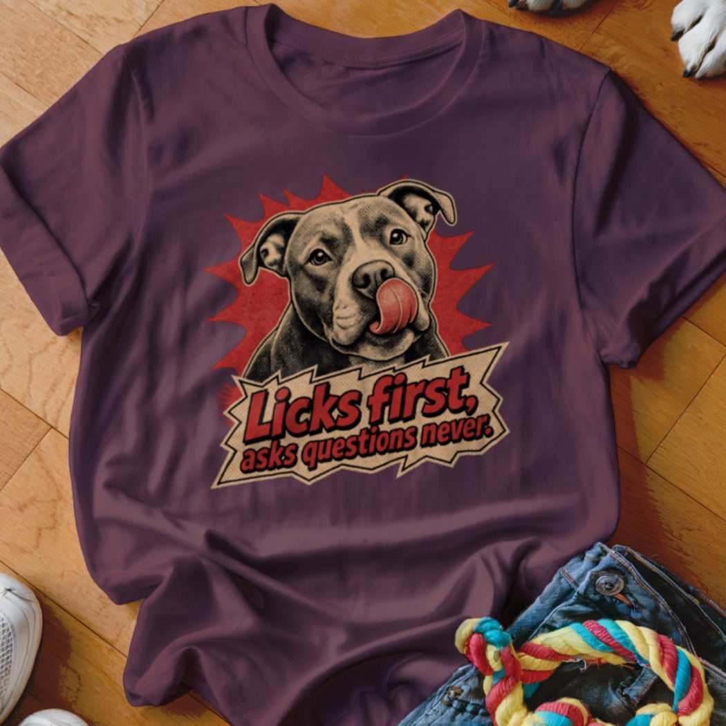 Pitbull with tongue out and text "Licks first, asks questions never".