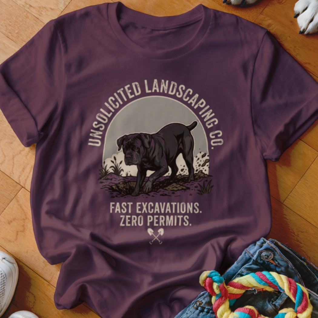 T-shirt with a dog graphic and text "Unsolicited Landscaping Co. Fast Excavations. Zero Permits."