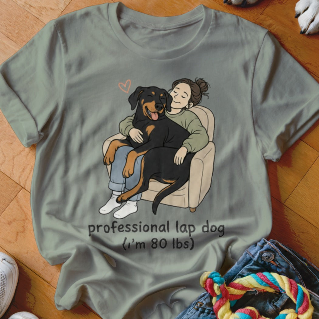 Illustration of a person hugging a large dog in a chair, with text "professional lap dog (I'm 80 lbs)".