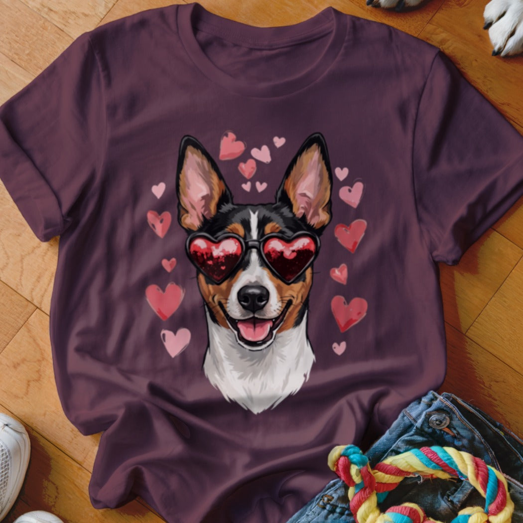 A plum-colored t-shirt displays a graphic of a dog wearing heart-shaped sunglasses, surrounded by pink hearts.