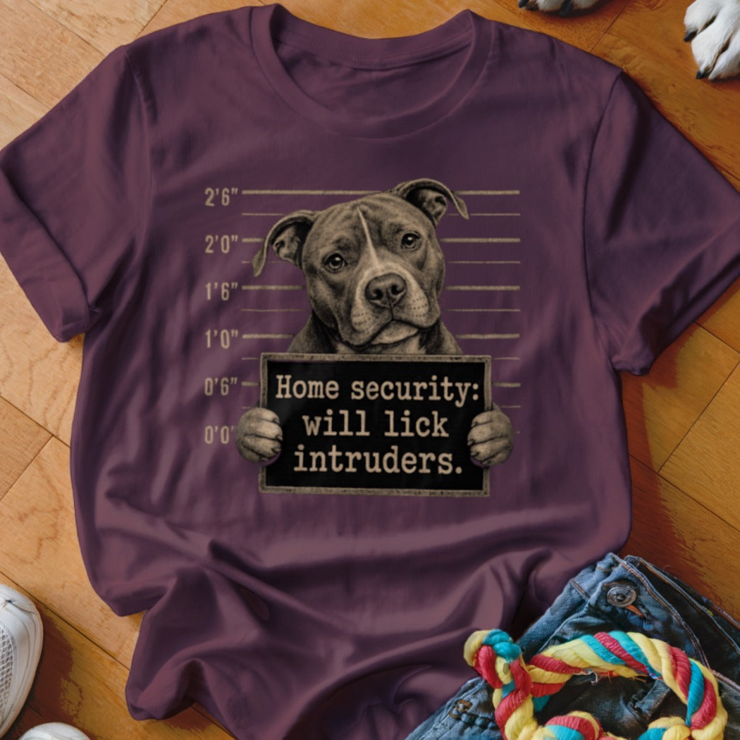 Pit bull mugshot with "Home security: will lick intruders" sign.