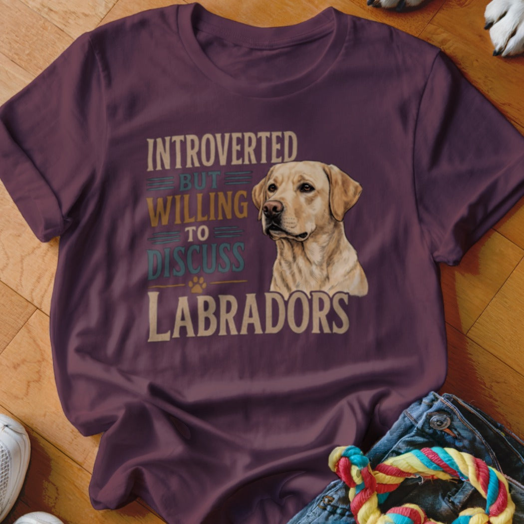 Maroon t-shirt with text "Introverted but willing to discuss Labradors" and dog image.