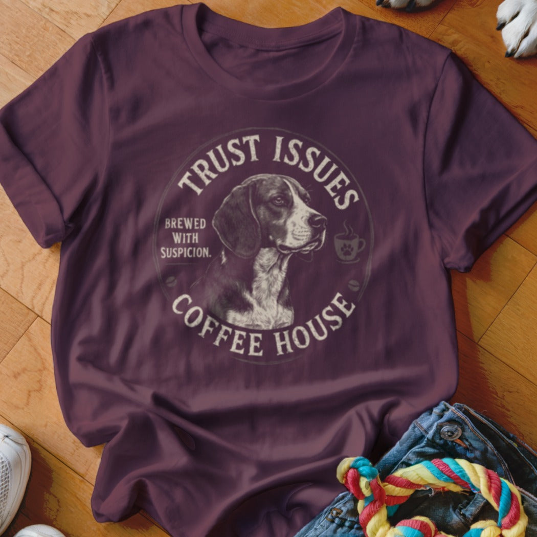 Maroon t-shirt with "Trust Issues Coffee House Brewed with Suspicion" circular graphic and dog.