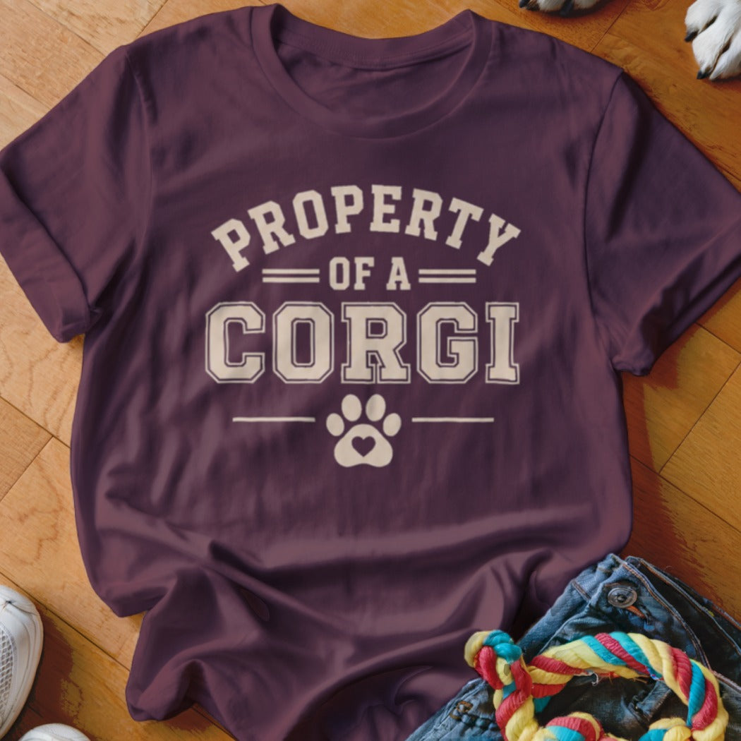 Maroon t-shirt with "Property of a Corgi" text and a paw print heart.