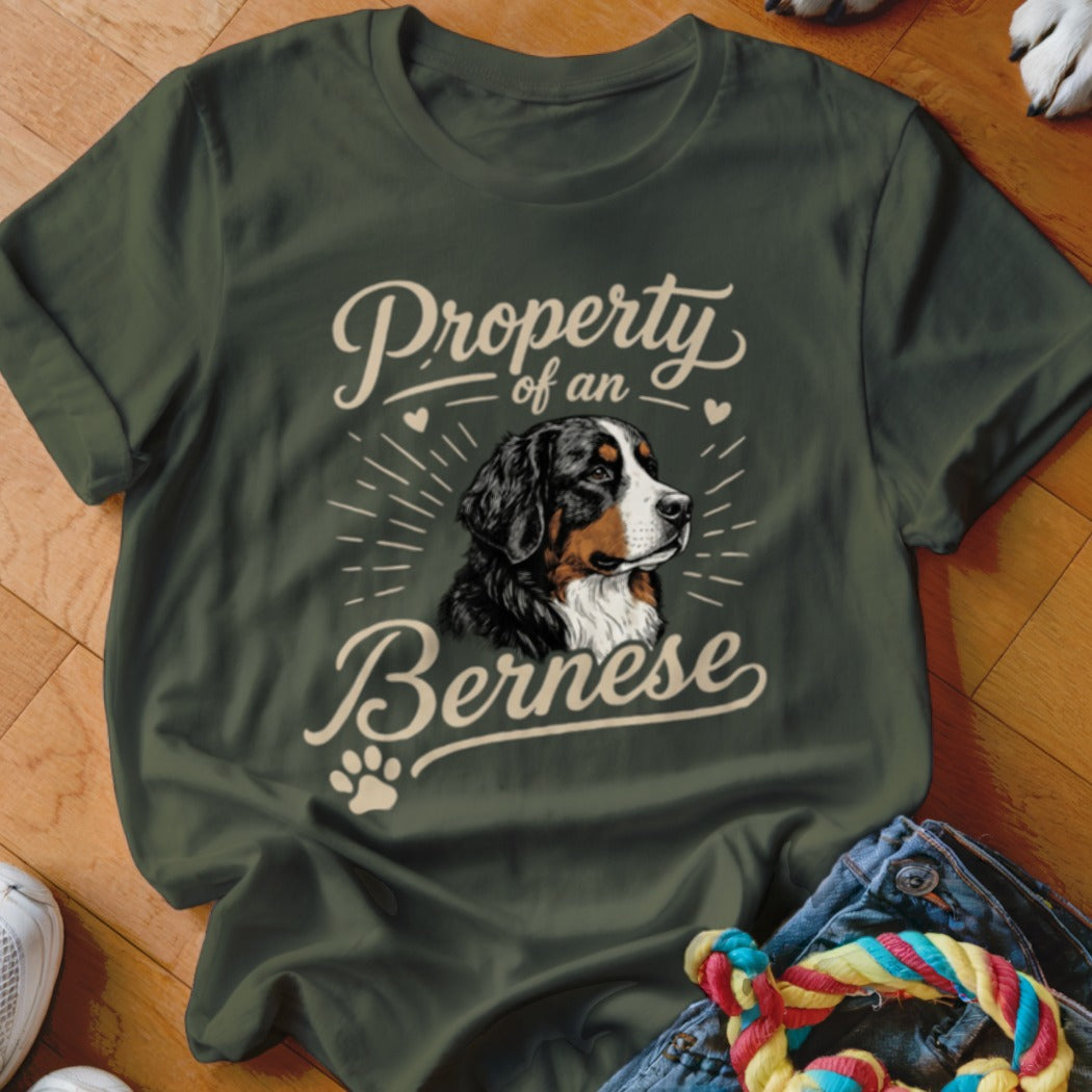 Dark green t-shirt with a Bernese Mountain Dog graphic and text reading Property of a Bernese.
