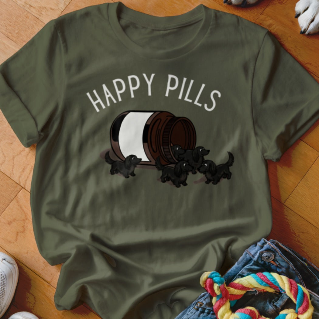 Green t-shirt with "Happy Pills" text and several dachshund puppies spilling from a pill bottle.