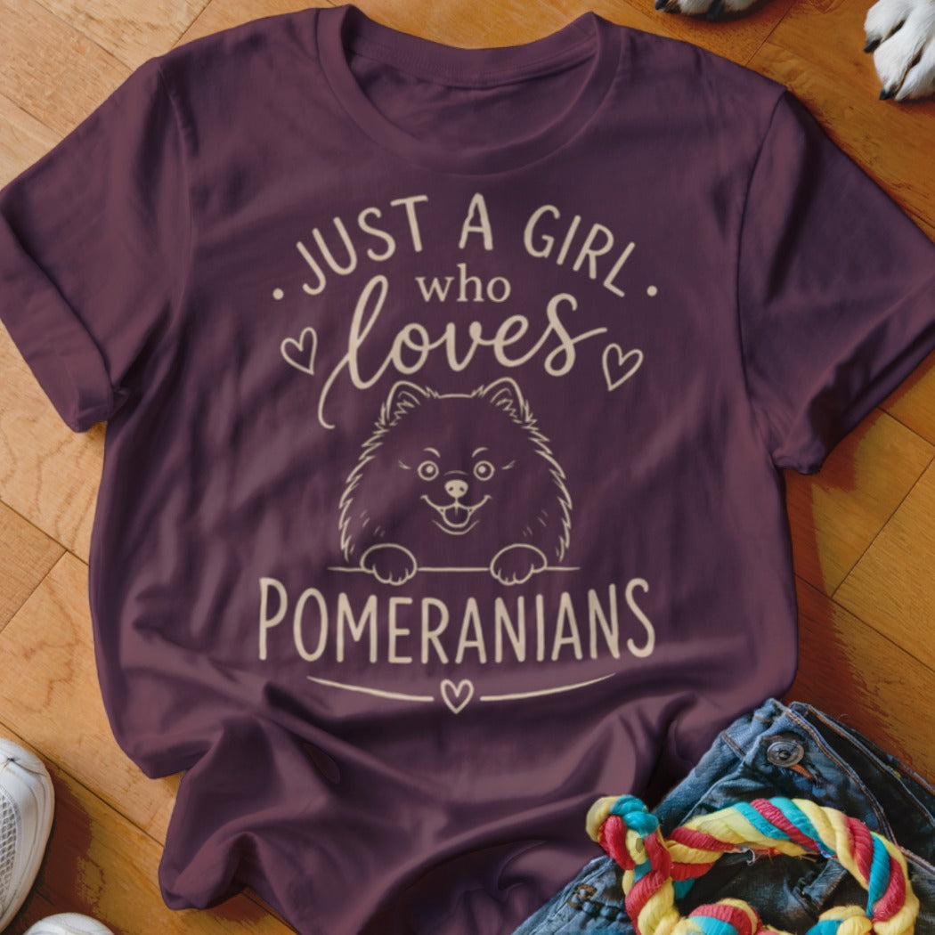 T-shirt with text "Just a girl who loves Pomeranians" and a drawing of a Pomeranian dog.