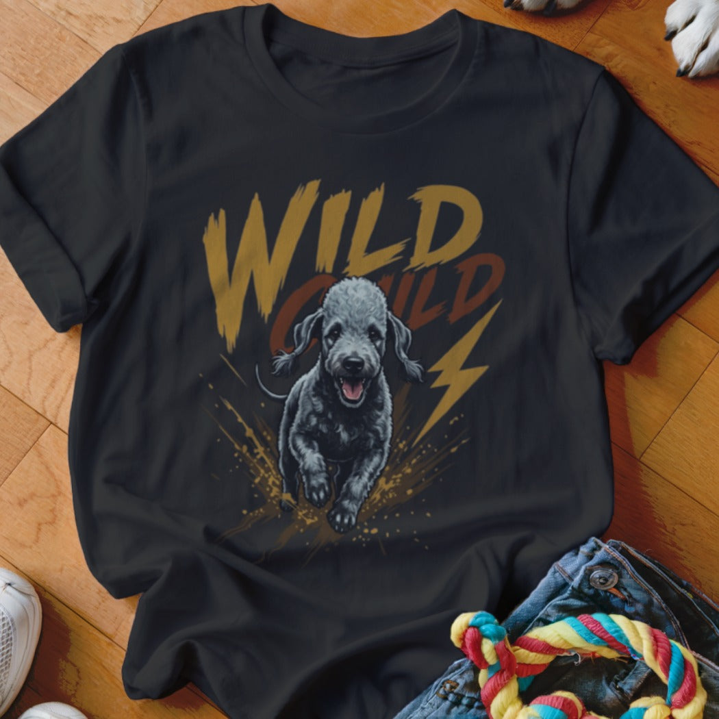 Black short-sleeved t-shirt featuring a graphic of a running black dog with text that reads WILD CHILD.