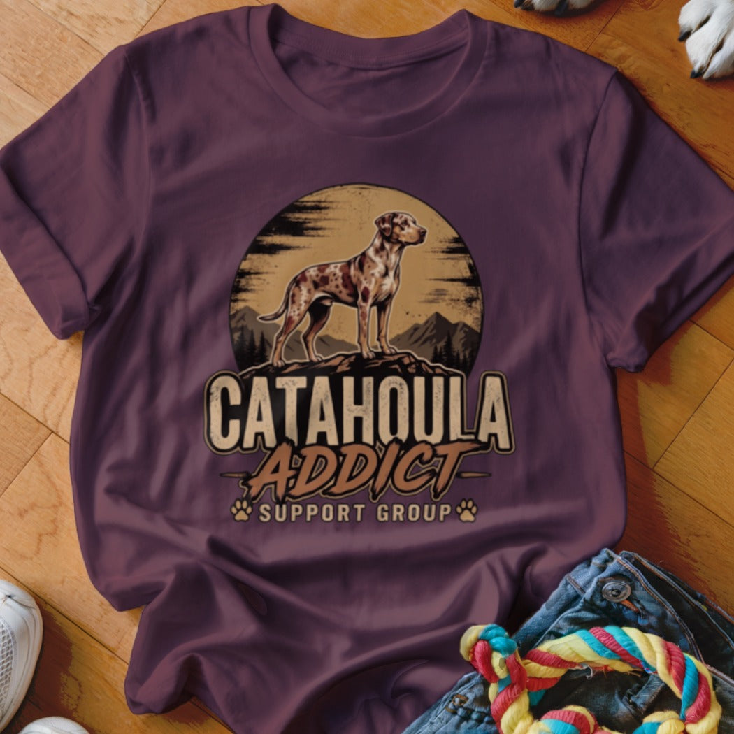 Maroon crewneck t-shirt featuring a vintage-style graphic of a spotted Catahoula dog and the text Catahoula Addict Support Group.