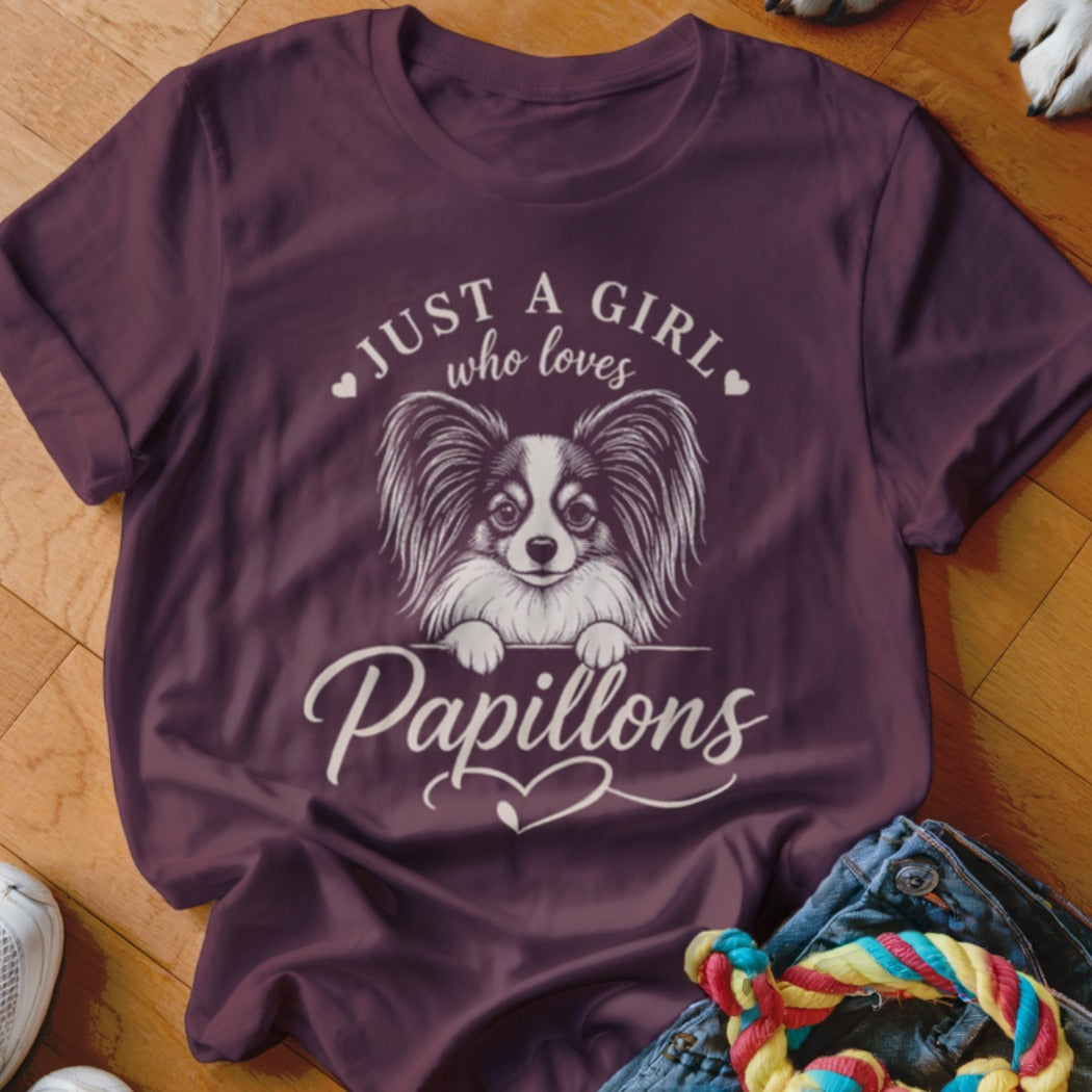 Maroon t-shirt with white text and graphics: "JUST A GIRL who loves Papillons" and a Papillon dog.