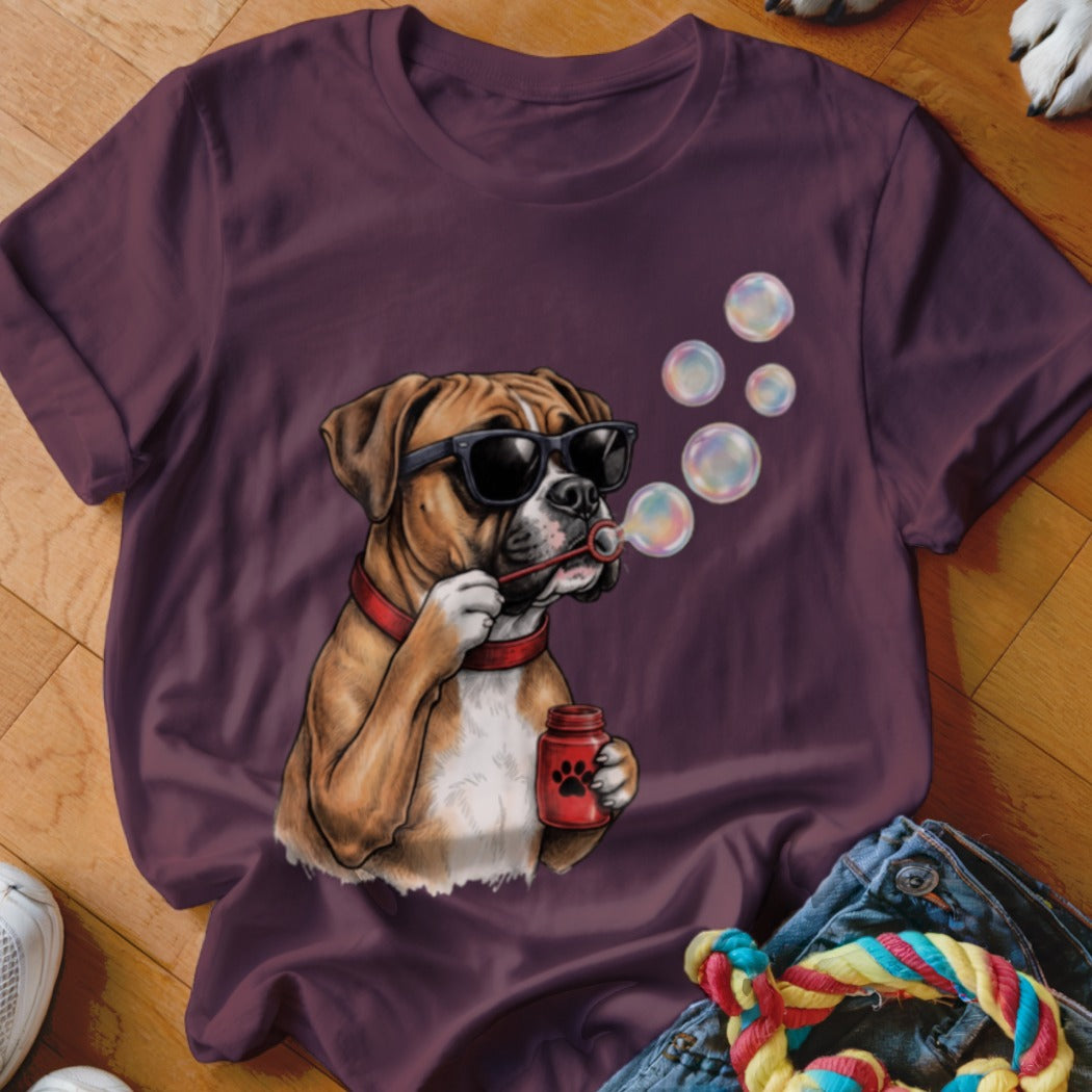 Maroon short-sleeved t-shirt featuring a graphic of a boxer dog wearing sunglasses and blowing bubbles.