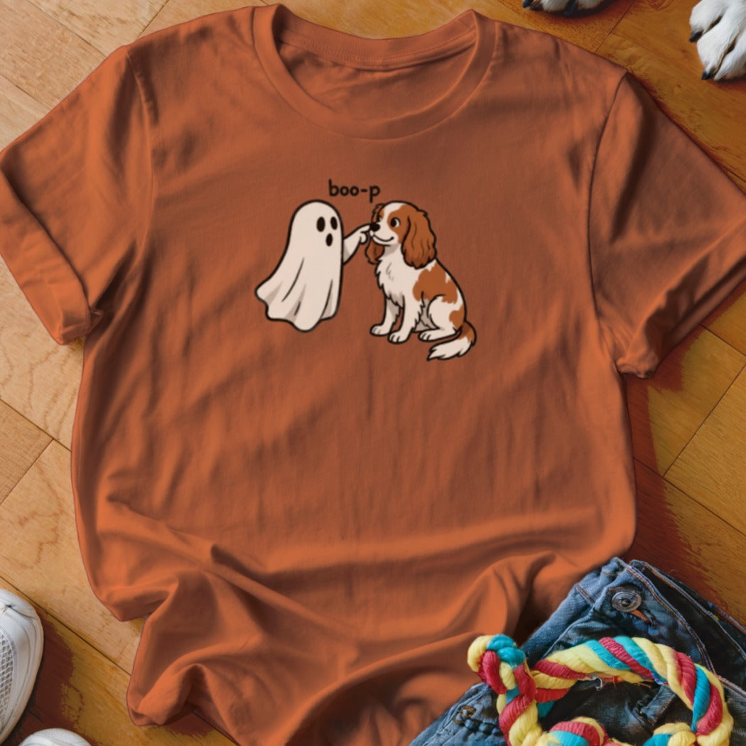 T-shirt graphic of a cartoon ghost booping a Cavalier King Charles Spaniel dog.