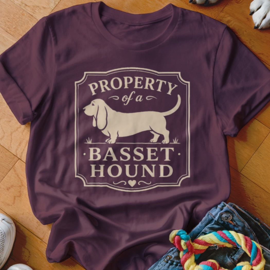 Maroon t-shirt with "Property of a Basset Hound" text and dog silhouette.