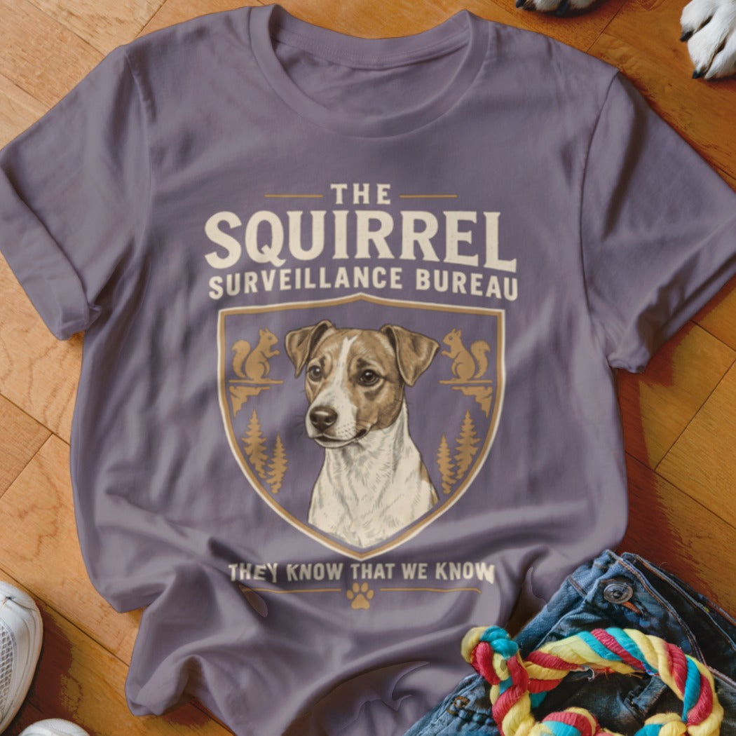 Purple crewneck t-shirt featuring a Jack Russell Terrier graphic and text reading The Squirrel Surveillance Bureau.