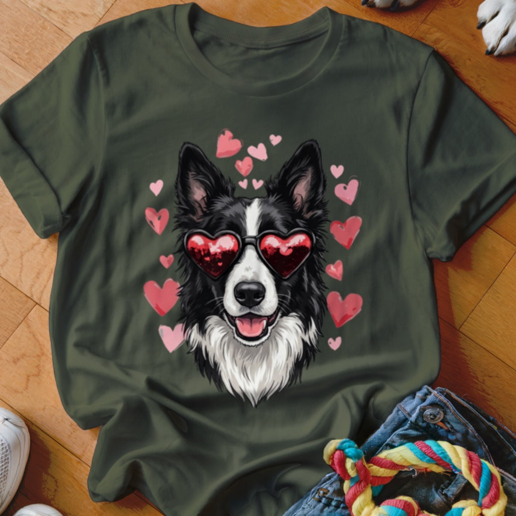 Dark green t-shirt featuring a graphic of a black and white dog wearing heart-shaped sunglasses surrounded by pink hearts.