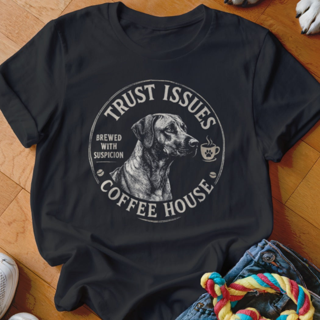 Black t-shirt with a circular logo featuring a dog, coffee cup, and text.