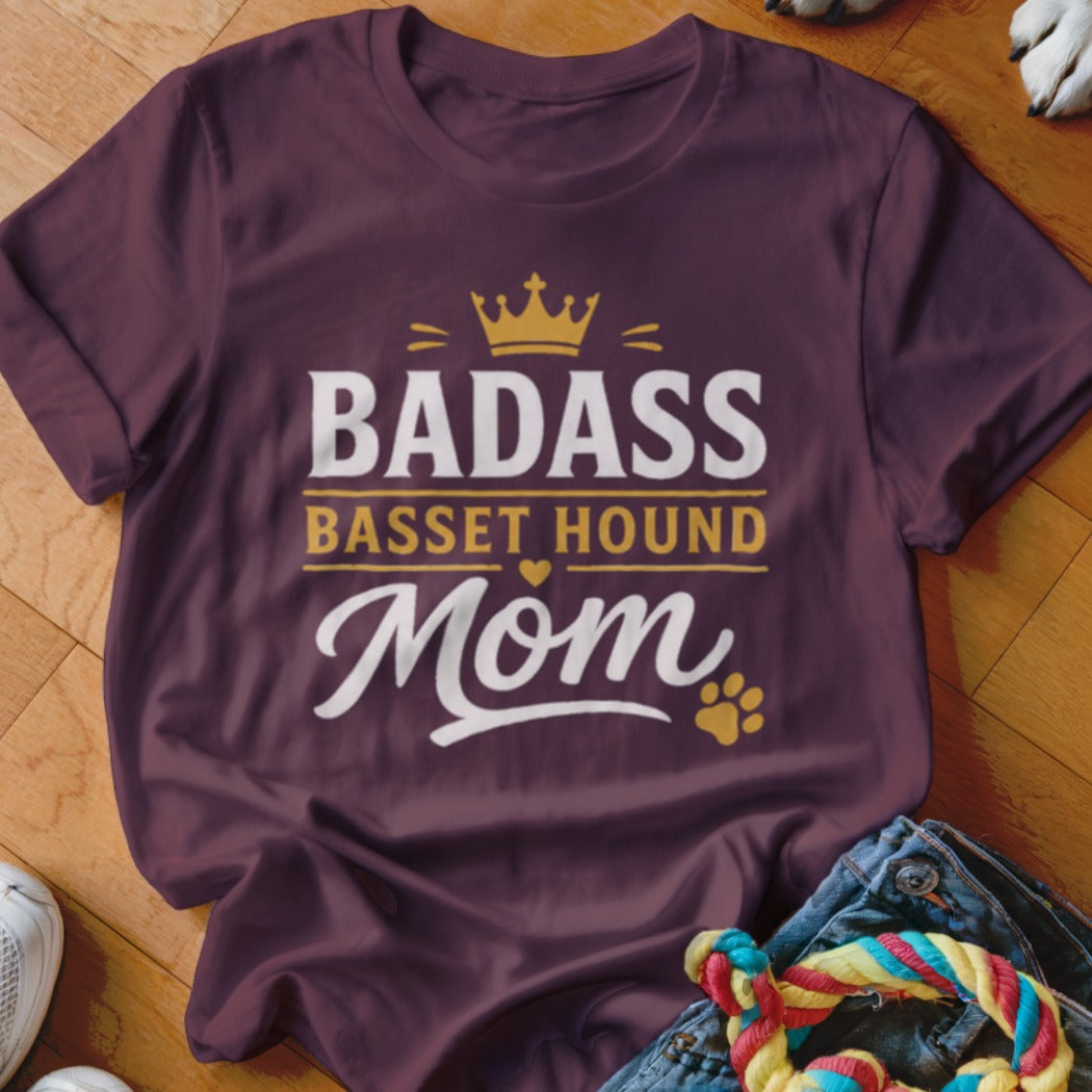 Maroon t-shirt with "Badass Basset Hound Mom" text and a crown graphic.