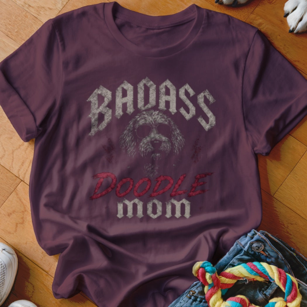 Maroon t-shirt with graphic of a dog wearing sunglasses, text "BADASS" and "DOODLE MOM".