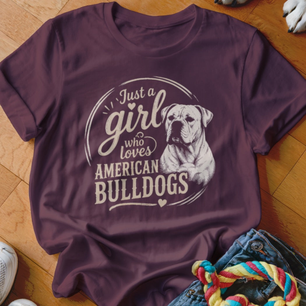 Burgundy t-shirt with "Just a girl who loves American Bulldogs" text and dog illustration.