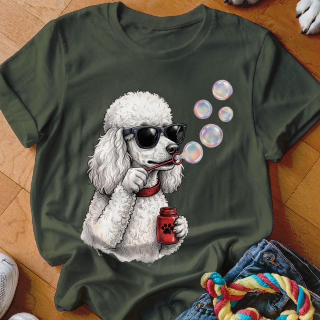 Dark green t-shirt featuring a graphic of a white poodle wearing sunglasses and blowing bubbles.