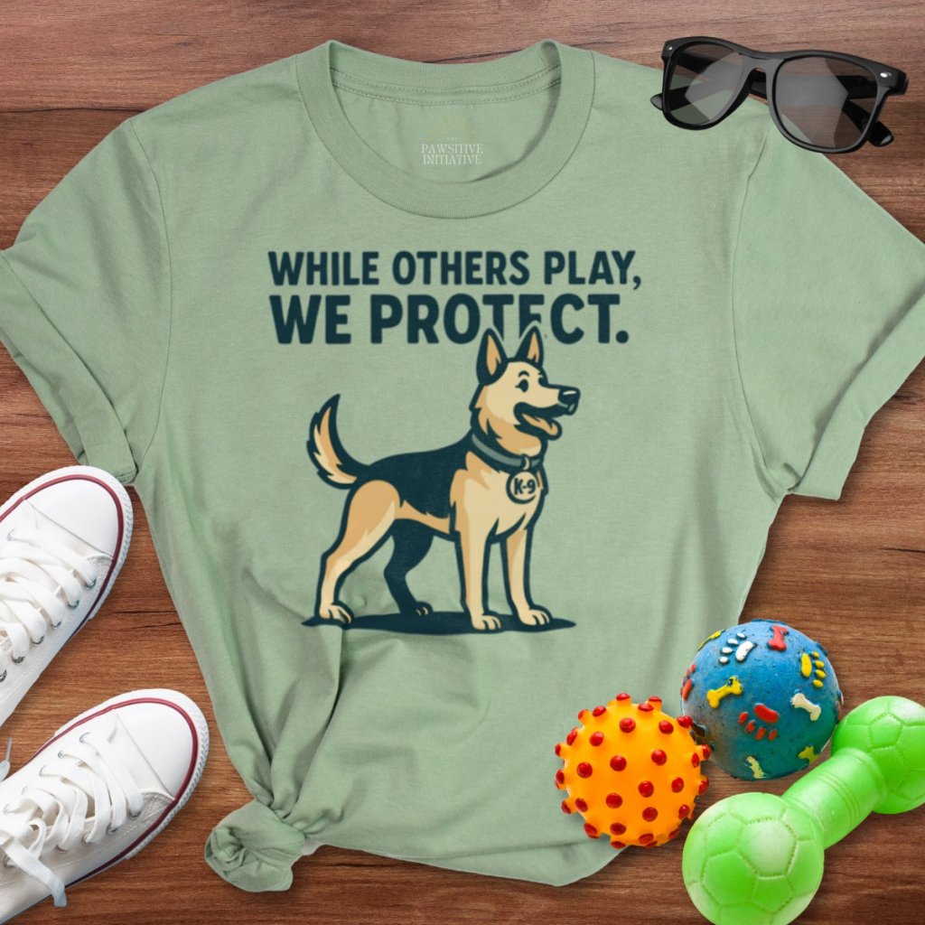 While Others Play Shirt - The Pawsitive Initiative