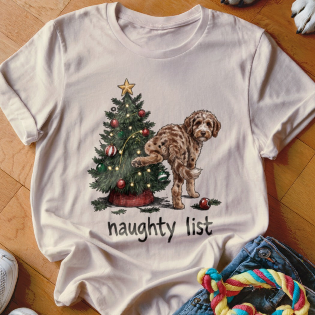 White t-shirt with Christmas tree and dog graphic, text reads "naughty list."
