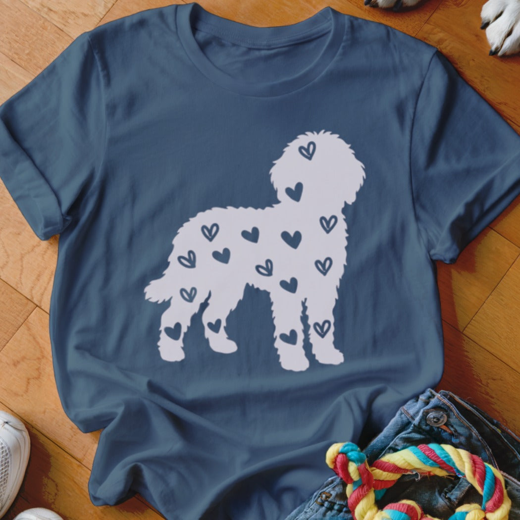 White dog silhouette filled with navy blue hearts on a navy blue t-shirt.