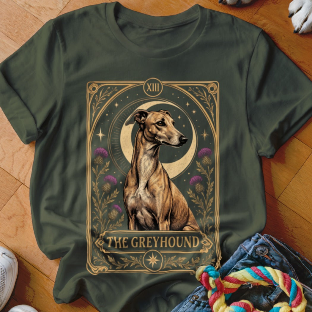 Dark green t-shirt featuring a tarot card style graphic of a greyhound dog, moon, and thistles.