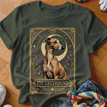 Dark green t-shirt featuring a tarot card style graphic of a greyhound dog, moon, and thistles.