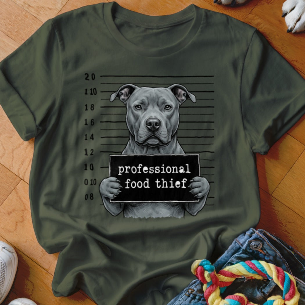 Pitbull mugshot with sign that reads "professional food thief"