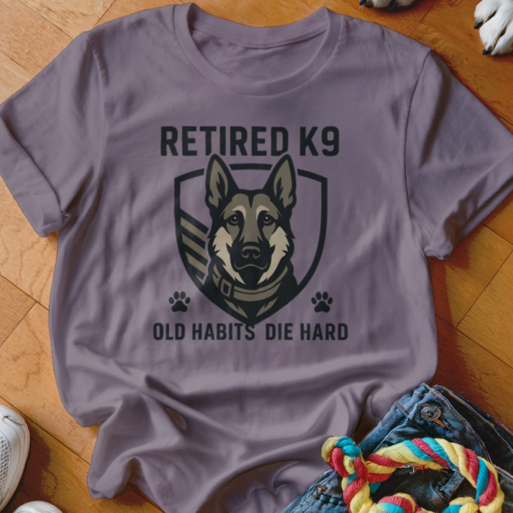 Purple t-shirt with "Retired K9 Old Habits Die Hard" text and a German Shepherd shield design.