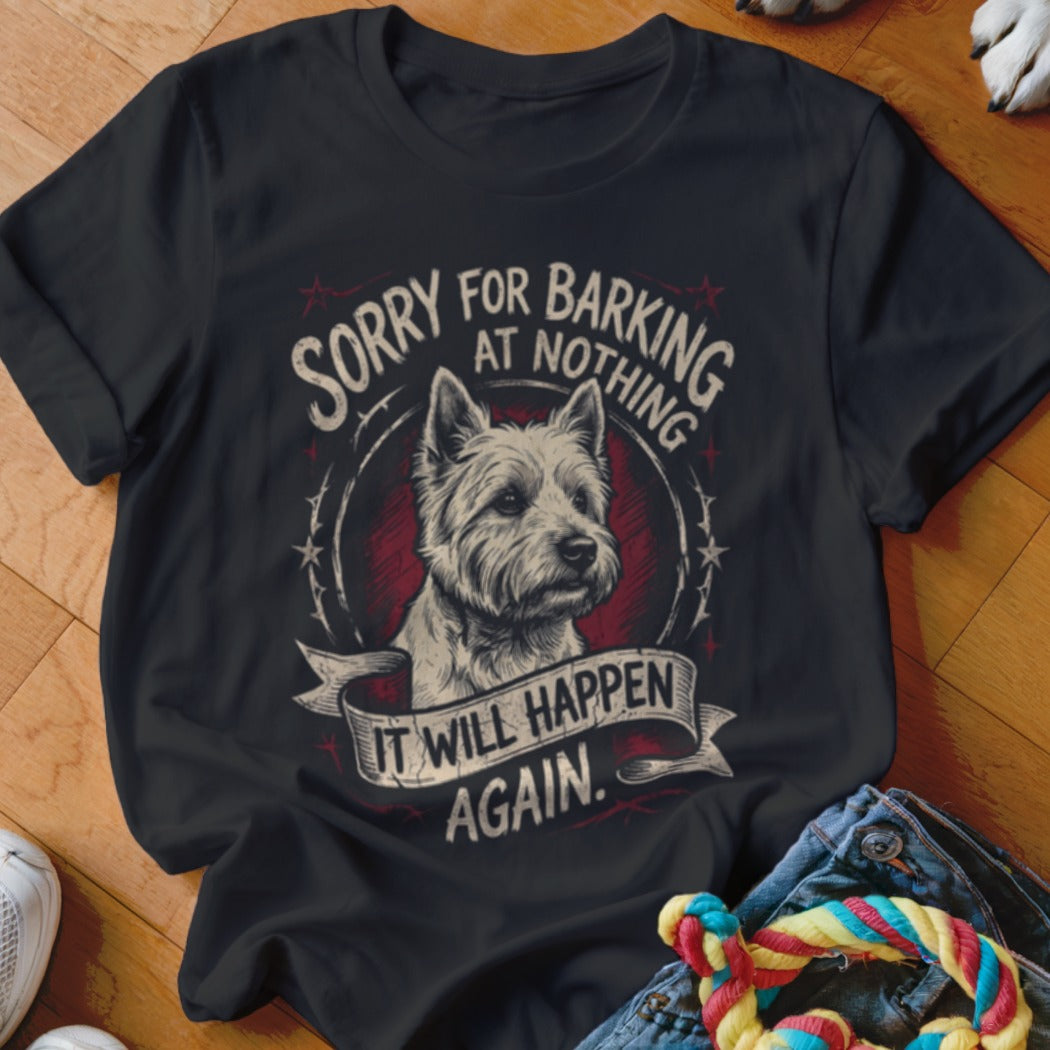 A black t-shirt features a graphic of a terrier inside a circular frame with text that reads, "Sorry for barking at nothing, it will happen again."