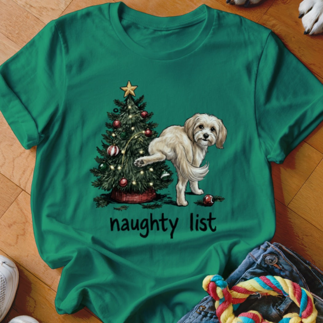 T-shirt graphic of a dog by a Christmas tree with text "naughty list".