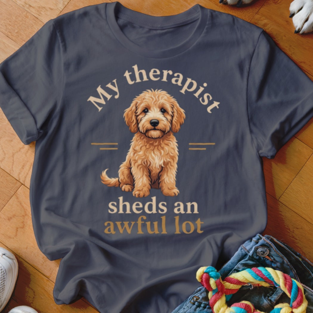 Dark grey t-shirt with a goldendoodle and text "My therapist sheds an awful lot".