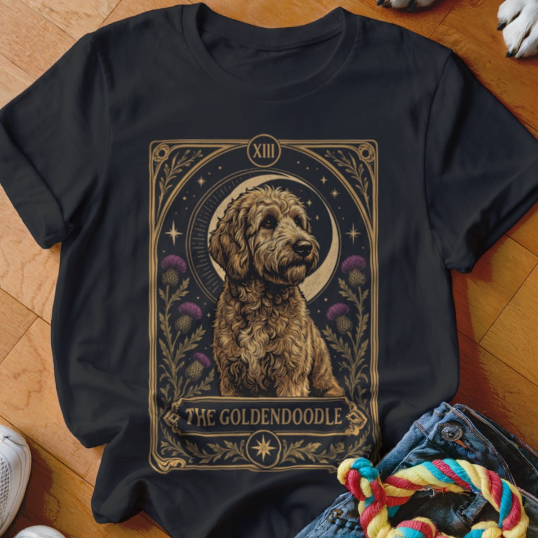 Black t-shirt featuring a tarot card style graphic of a goldendoodle surrounded by thistles.