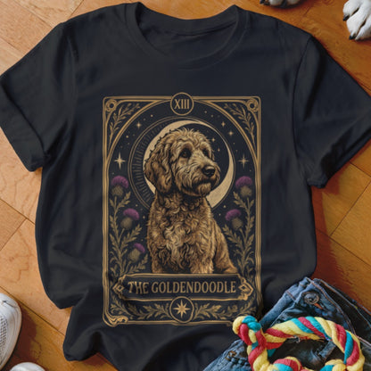 Black t-shirt featuring a tarot card style graphic of a goldendoodle surrounded by thistles.