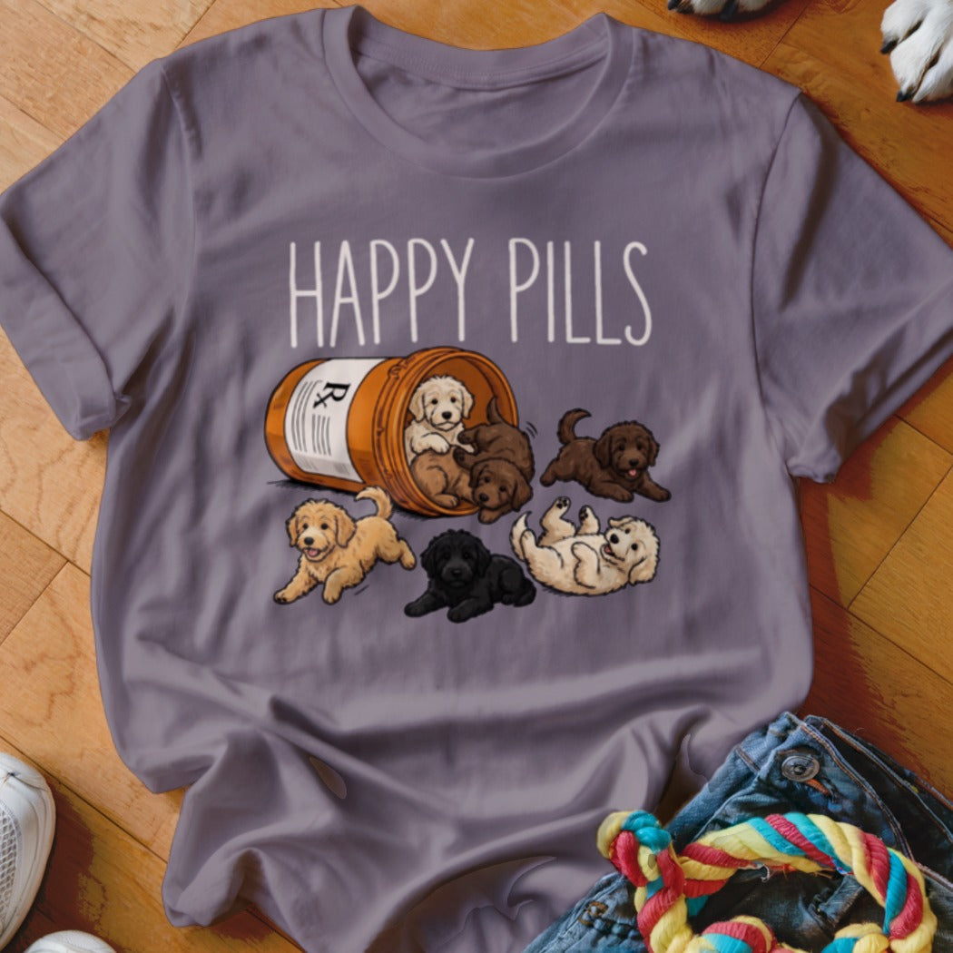 T-shirt with "Happy Pills" text and scattered puppies spilling from a prescription bottle.