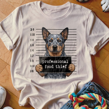 Australian Cattle Dog mugshot graphic reading "professional food thief".