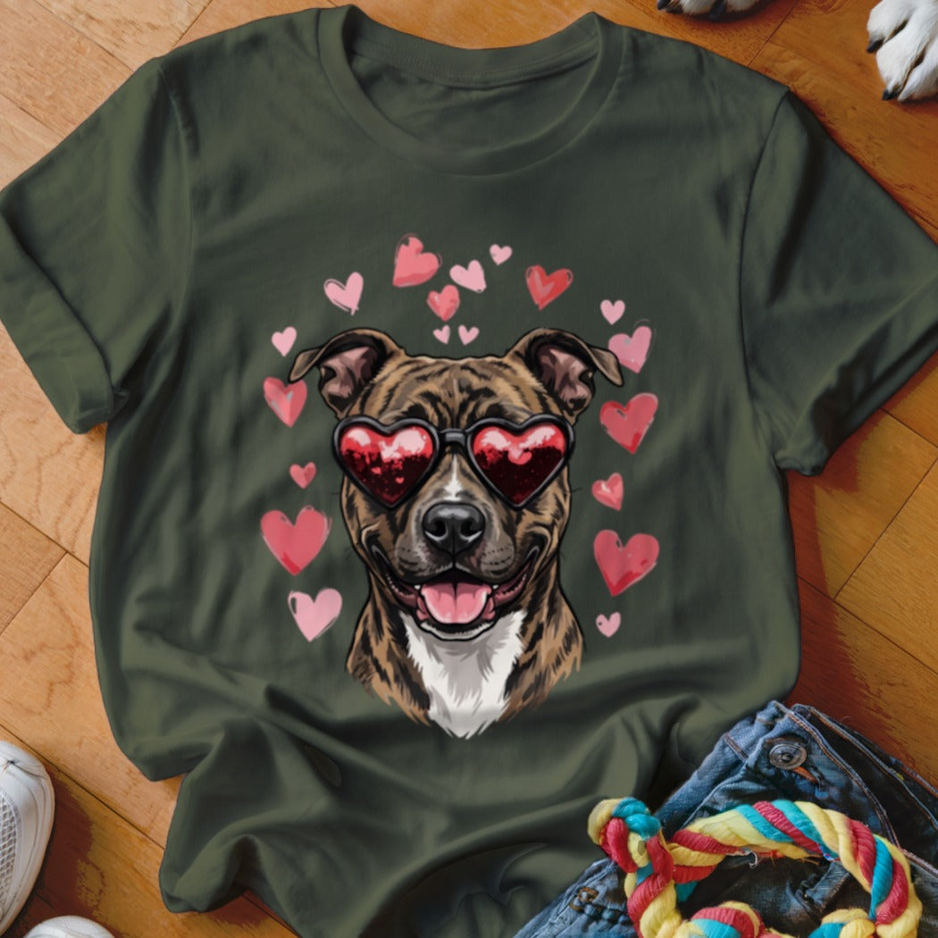 Dark green t-shirt featuring a graphic of a brindle dog wearing heart-shaped sunglasses surrounded by pink hearts.