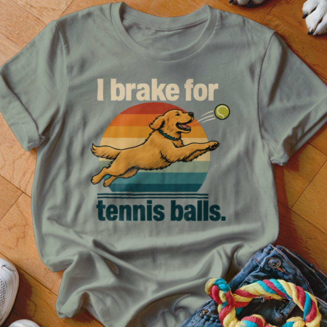 T-shirt with golden retriever leaping for a tennis ball and text "I brake for tennis balls."