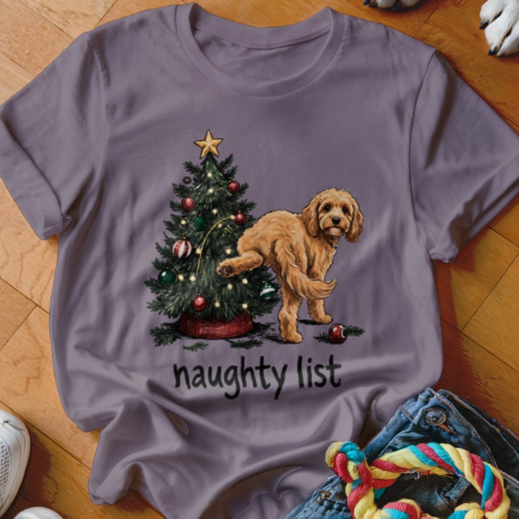 Light purple t-shirt with a Christmas tree and a dog on the "naughty list."