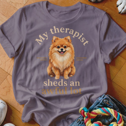 Purple t-shirt with Pomeranian dog graphic and text "My therapist sheds an awful lot".