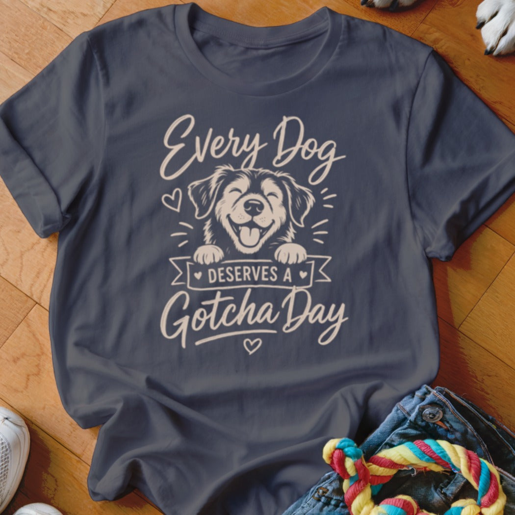 Dark blue t-shirt with "Every Dog Deserves A Gotcha Day" and a happy dog illustration.