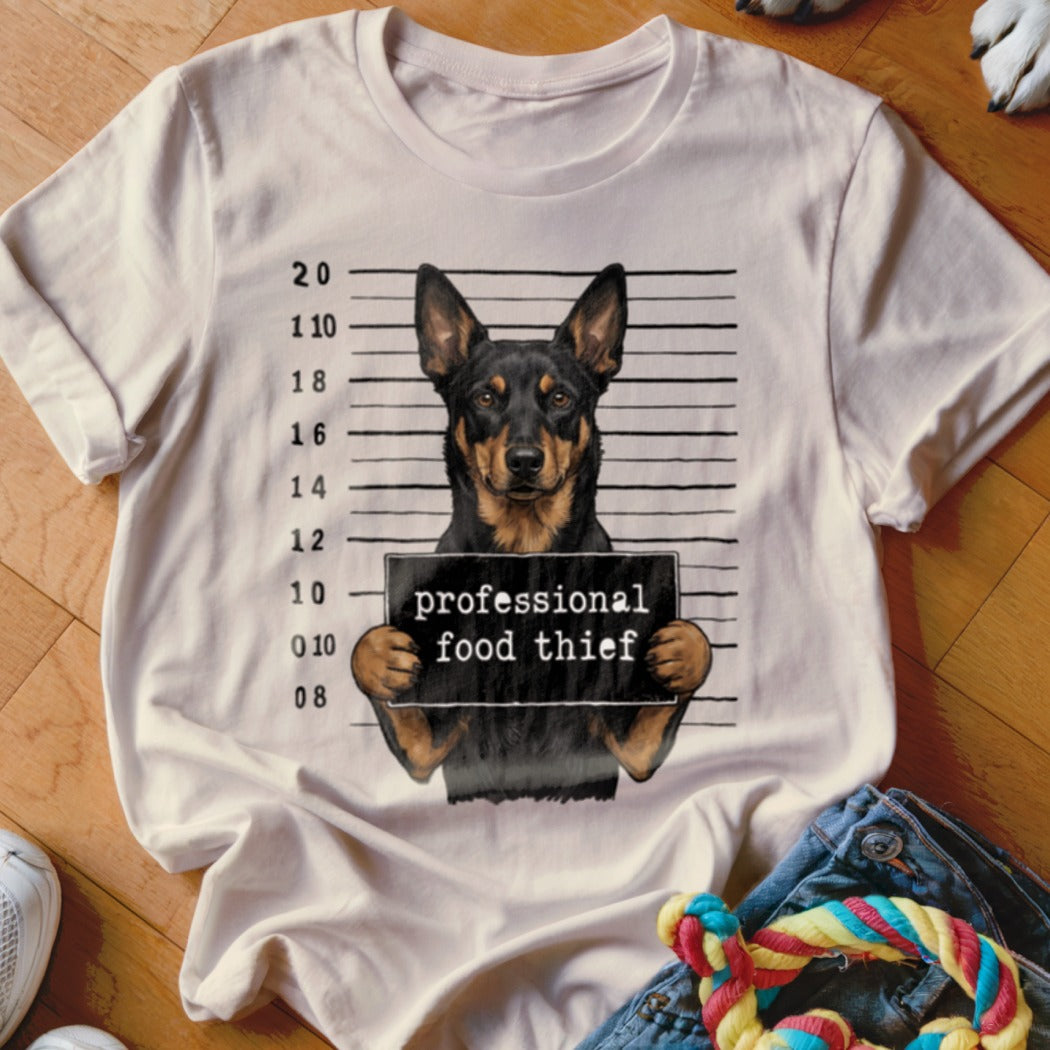 Dog mugshot graphic with text "professional food thief" on a t-shirt.