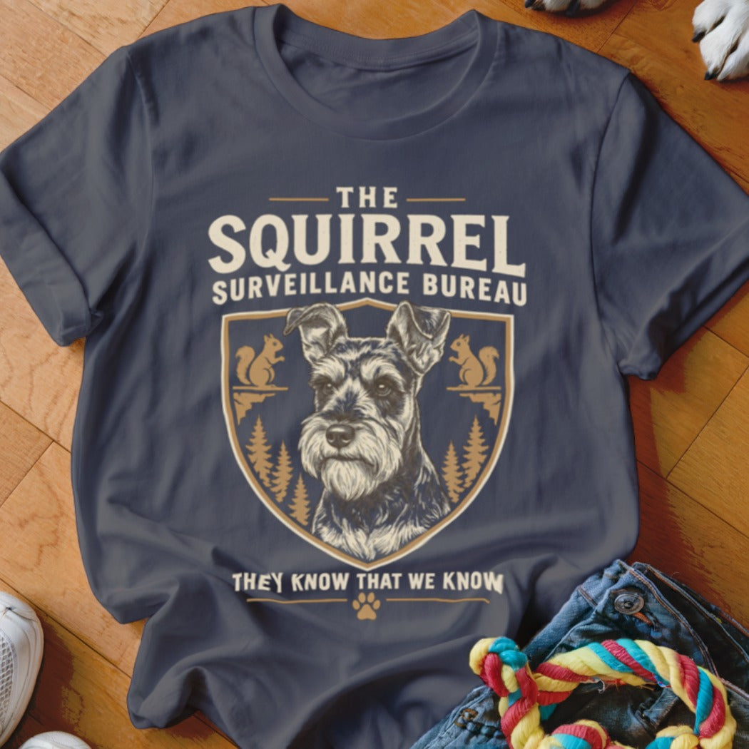 Charcoal gray t-shirt featuring a graphic of a Schnauzer and text reading "The Squirrel Surveillance Bureau."