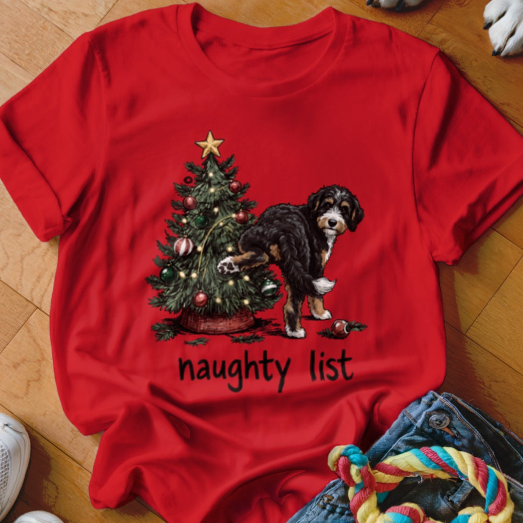 Bernese Mountain Dog peeing on Christmas tree with "naughty list" text.